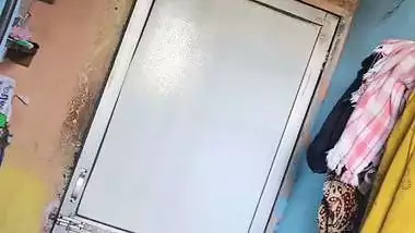 Perverted neighbor records a desi milf bathing in her bathroom