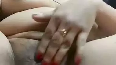 Chubby, young lady enjoys fingering her shaved pussy